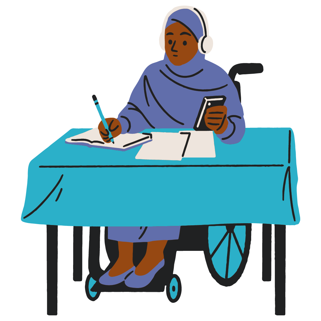 A woman in a hijab sits in her wheelchair at a desk, working with headphones on.